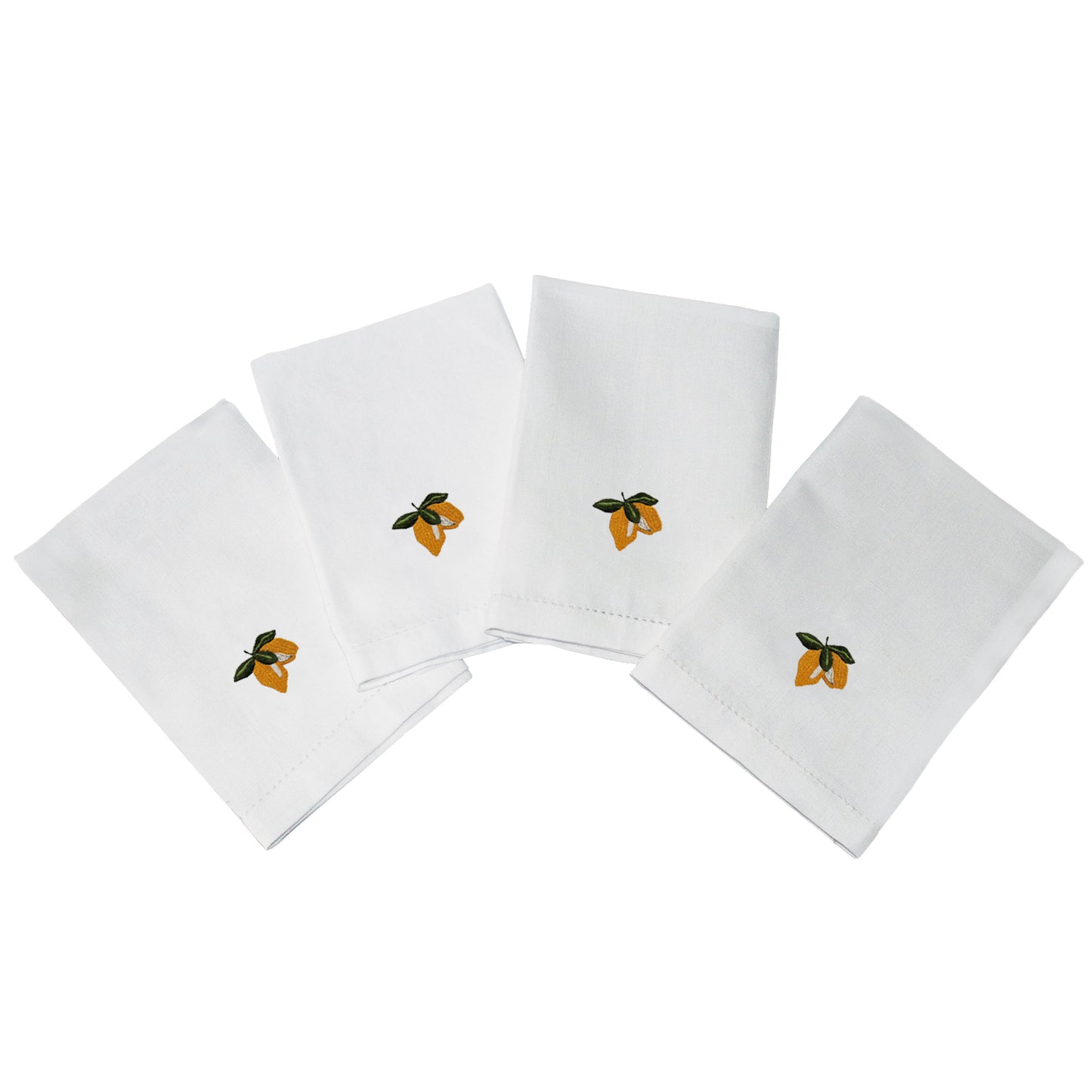 Set of four white napkins with embroidered lemon designs on a white background