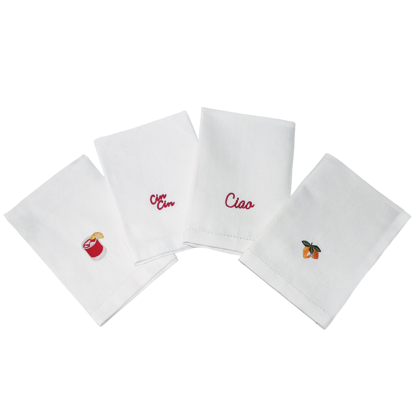 Set of four white napkins with embroidered designs on a white background