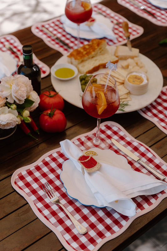 Handwoven iraca palm napkin ring inspired by the Negroni cocktail. A spirited accent for Italian tables and aperitivo entertaining.