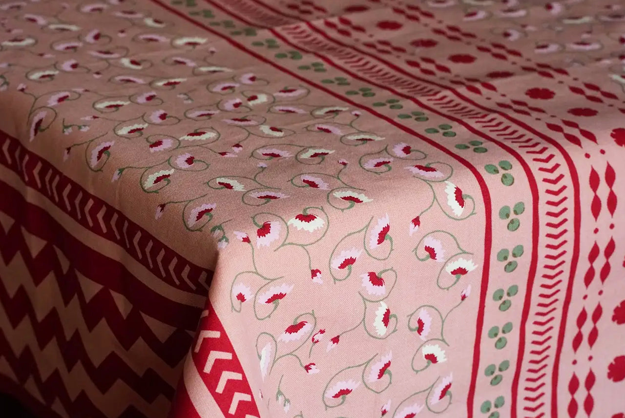 La Leccia detailed floral and geometric tablecloth in dark pink. Hand screen printed in India. 