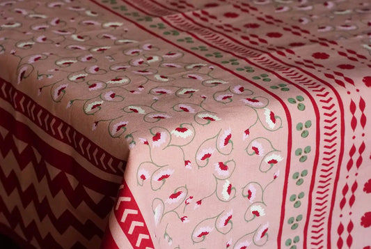 La Leccia detailed floral and geometric tablecloth in dark pink. Hand screen printed in India. 