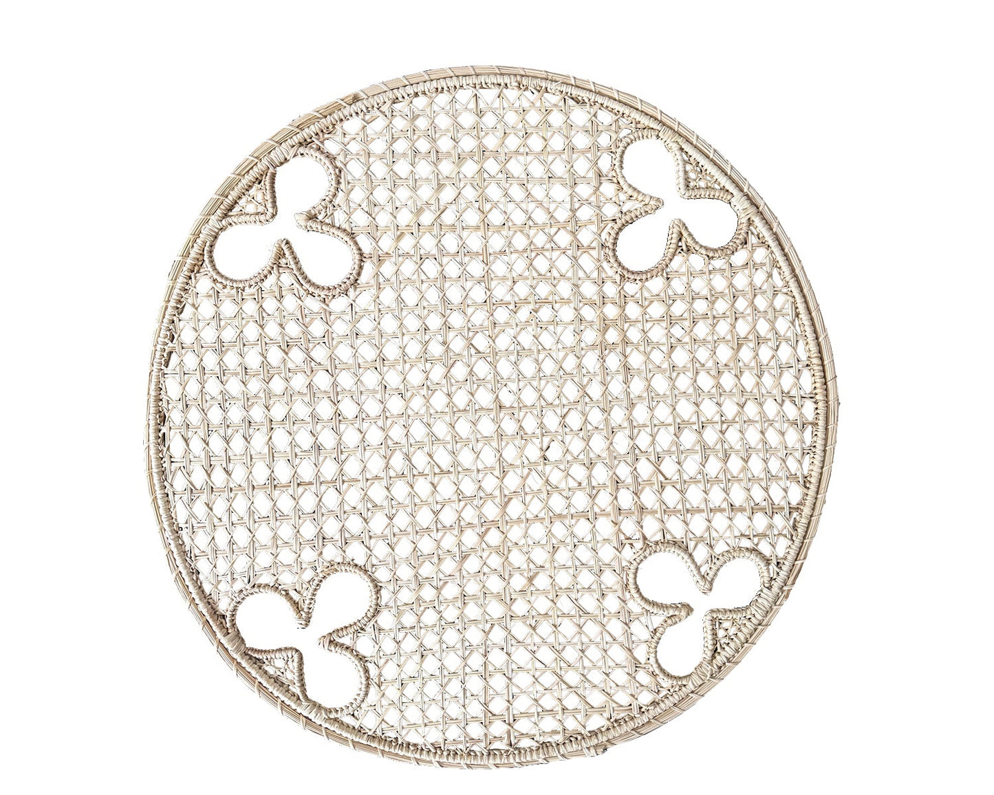 Round, handwoven, Iraca charger with olive motifs. 