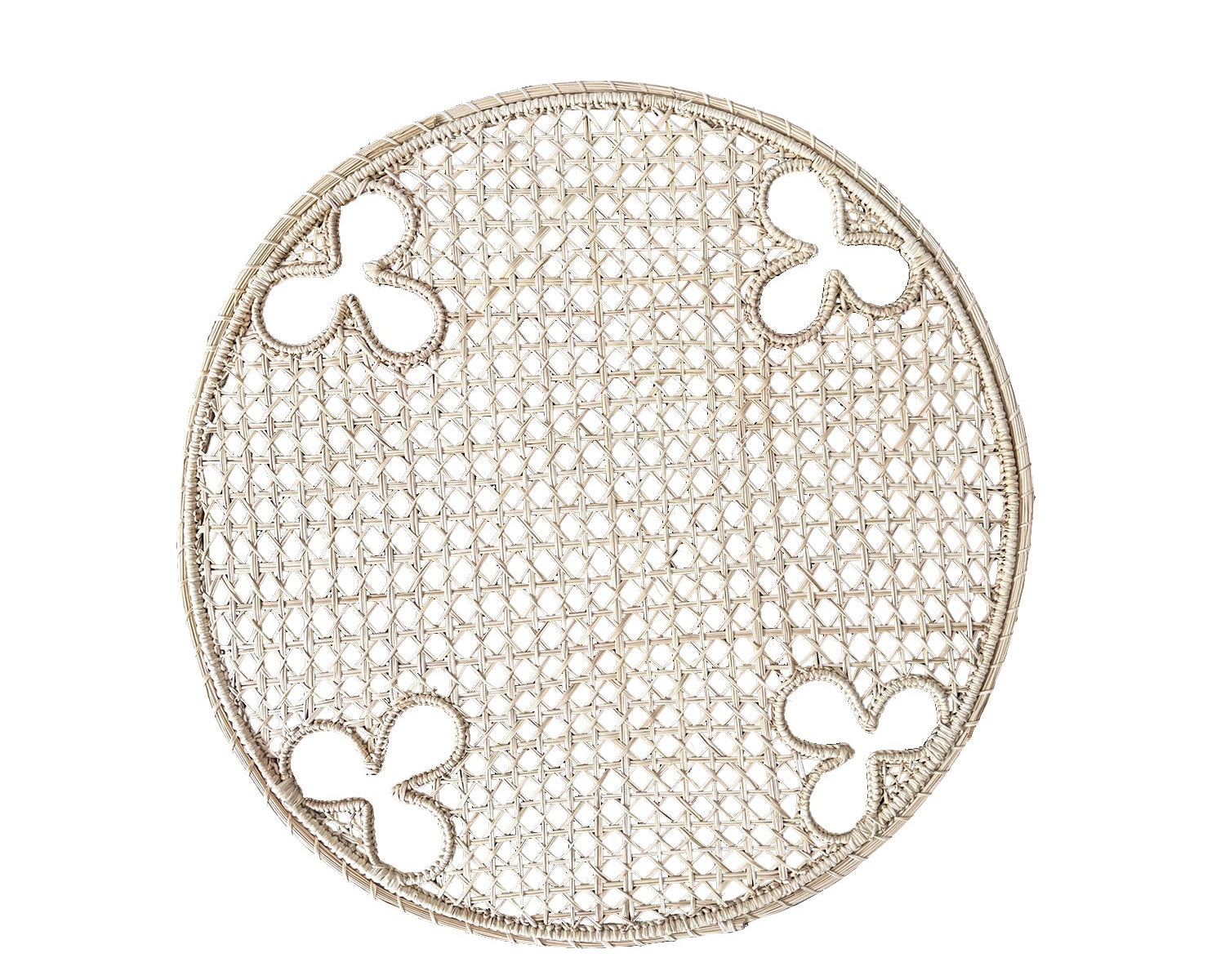 Round, handwoven, Iraca charger with olive motifs. 