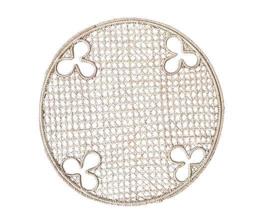 Round, handwoven, Iraca charger with olive motifs. 