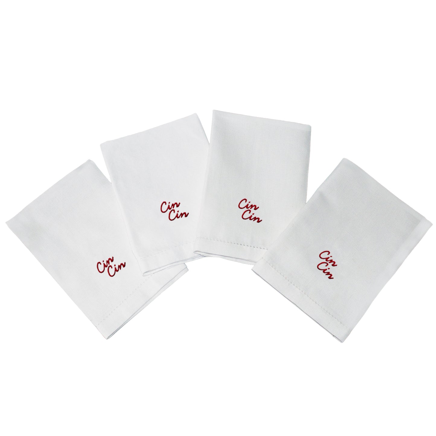 Set of white napkins with 'Cin Cin' embroidery on a white background